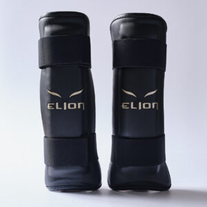 Protège tibias ELION 10ème Anniversaire – Noir/Or – Offre partenaire club -10%